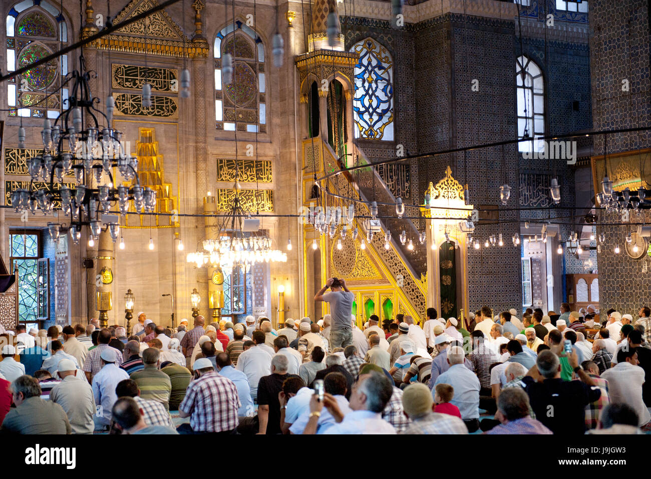 Men praying at New Mosque during Ramadan,Istanbul,Turkey Stock Photo
