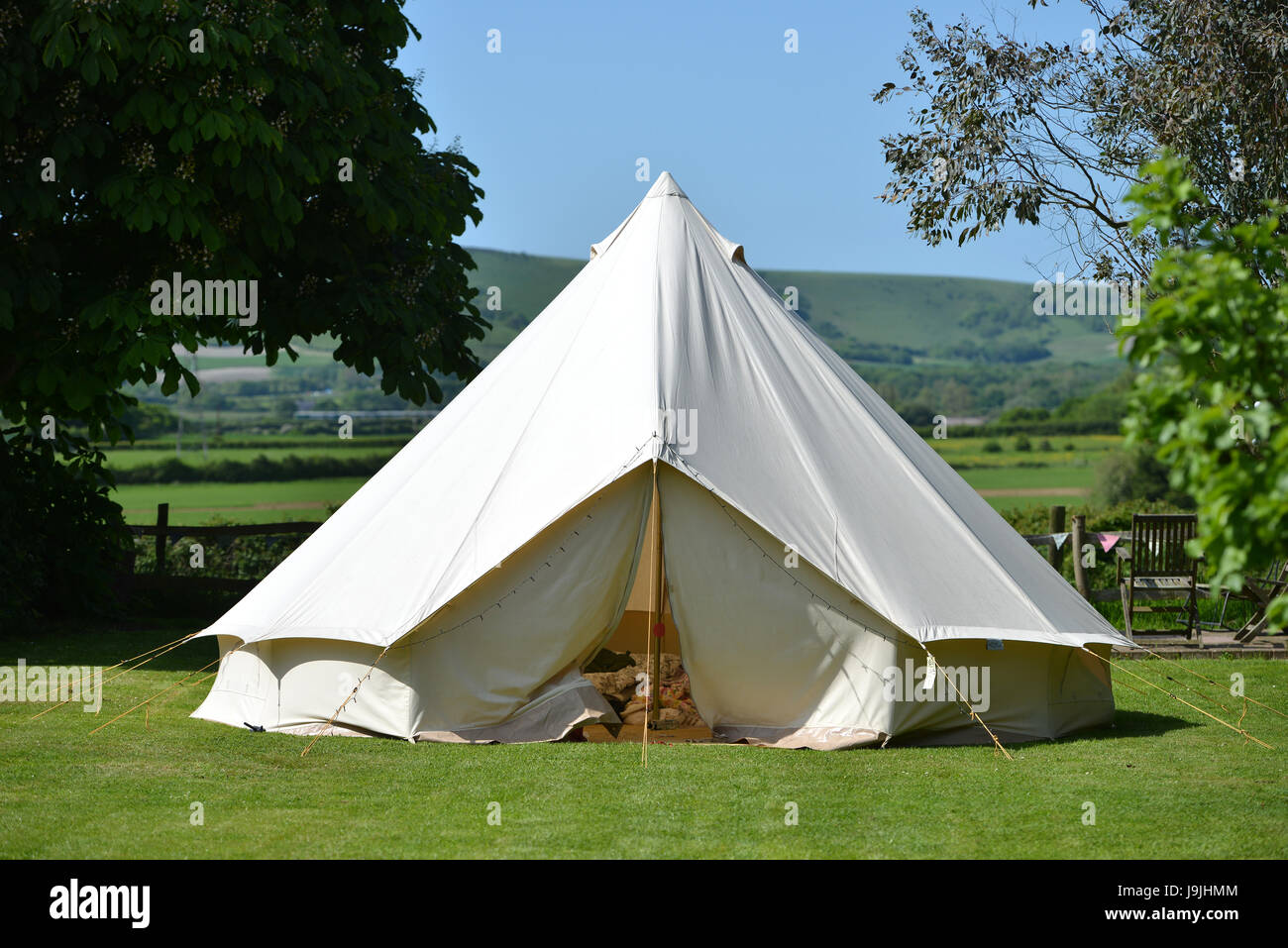Canvas bell tent n the Sussex countryside with the South Downs in the background Stock Photo