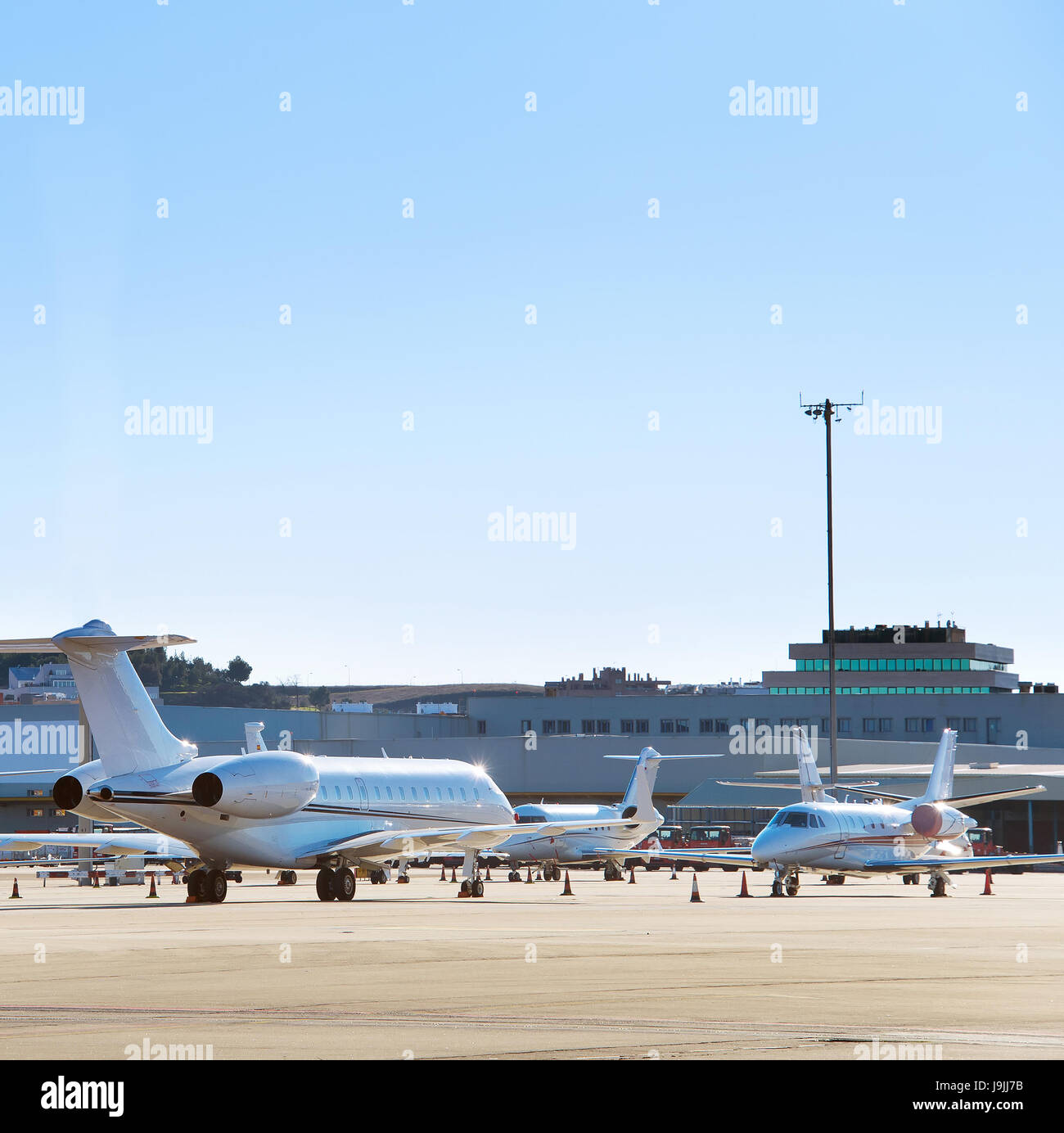 Modern planes at airport in the bright sunny day Stock Photo