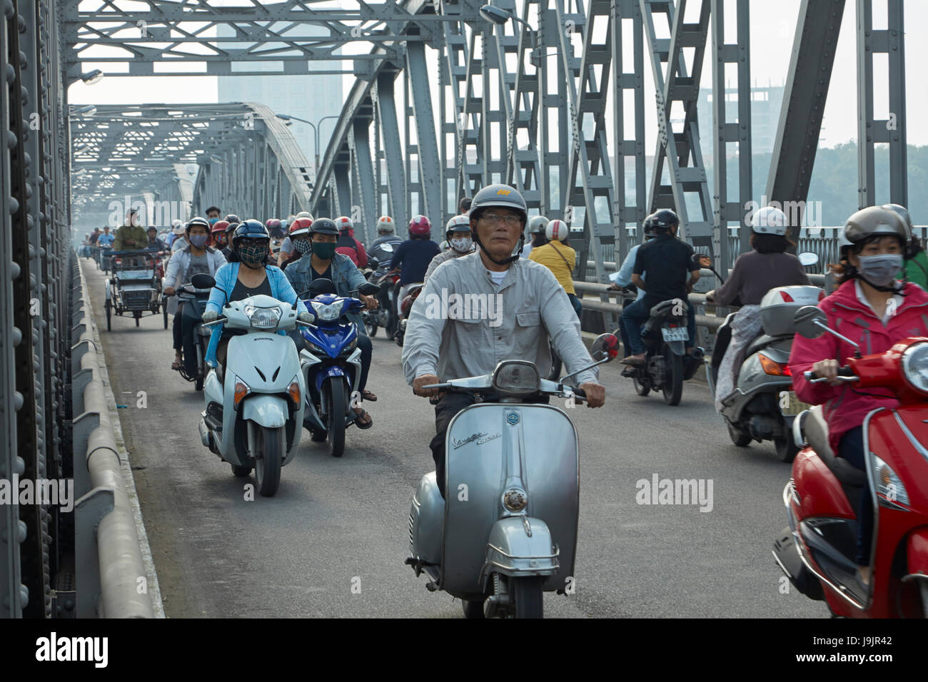 Motorcycles on Trang Tien Bridge across Perfume River, Hue, North Central Coast, Vietnam Stock Photo
