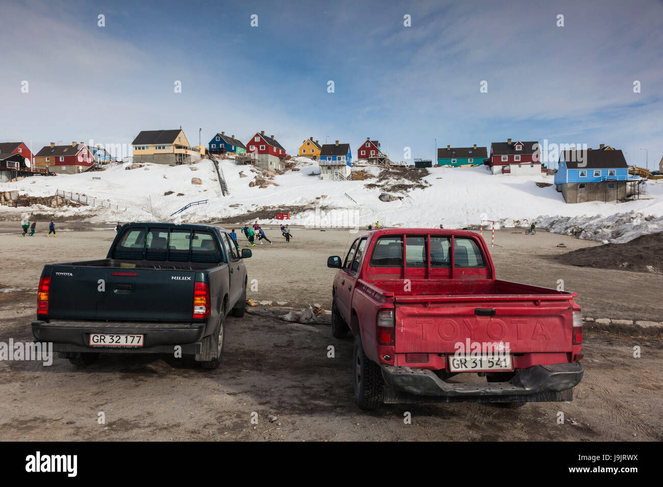 Greenland, Disko Bay, Ilulissat, soccer field and pickup trucks Stock