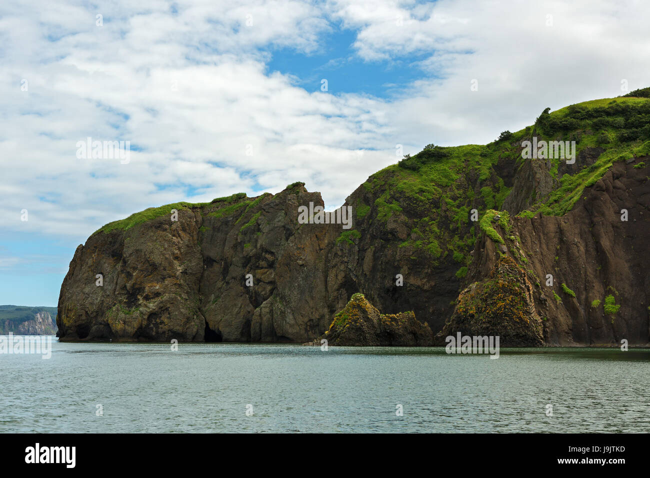Rocks in Avacha Bay of the Pacific Ocean. The coast of Kamchatka Stock ...