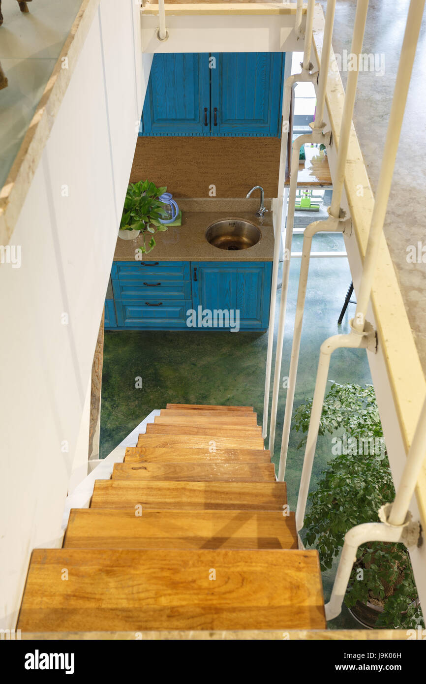Modern home kitchen and staircase, interior design Stock Photo - Alamy