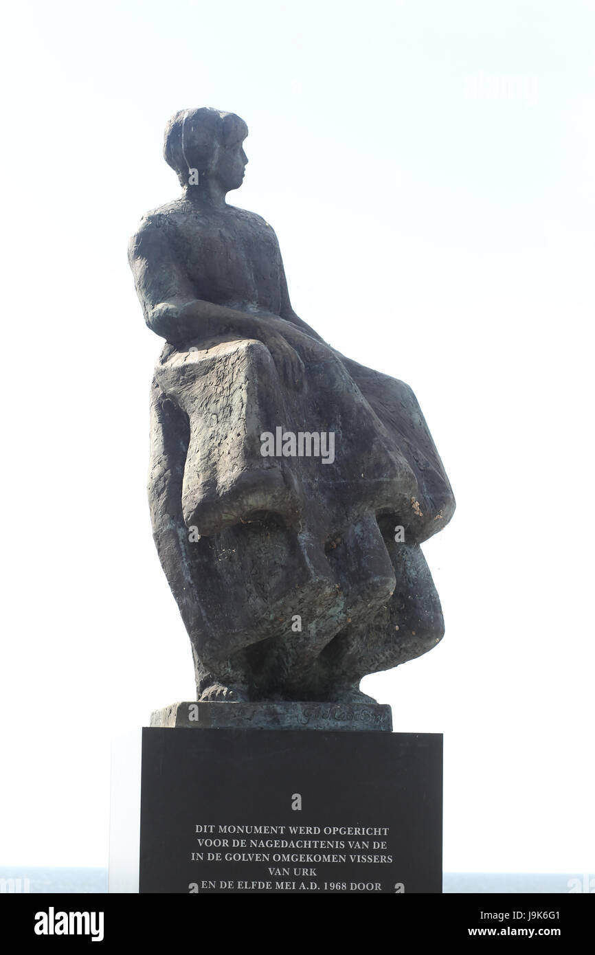 Memorial located in Urk, Netherlands, a tribute to all the men who perished at sea. The plaques on the wall lists the men in the year they were lost. Stock Photo
