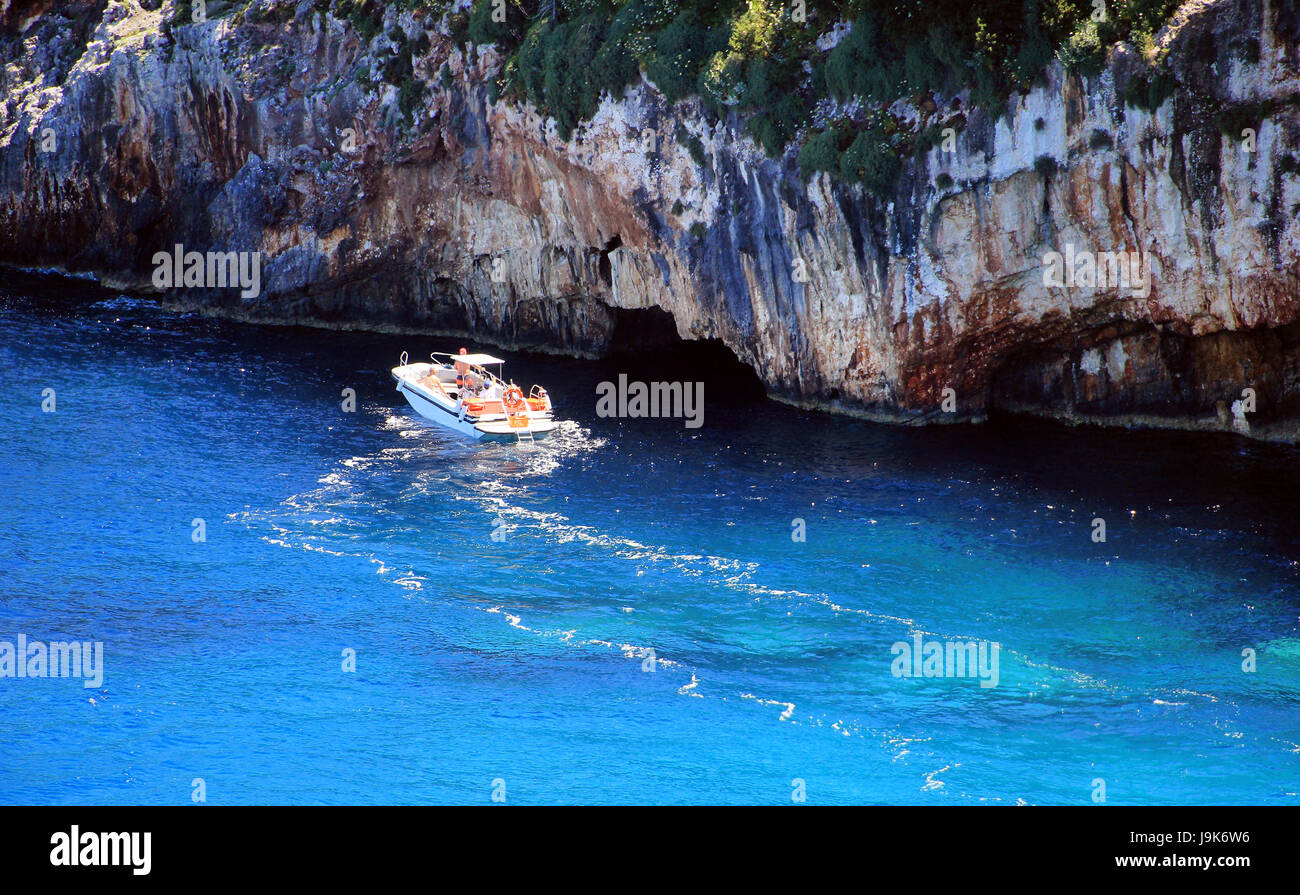 Small boat near blue caves on Zakynthos island, Greece, Stock Photo