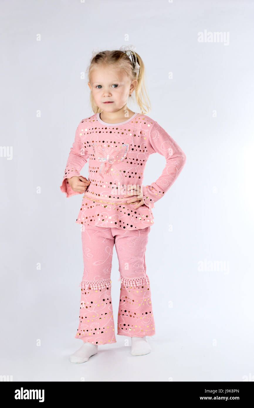 Studio portrait of a curious shy little girl with blond hair Stock ...
