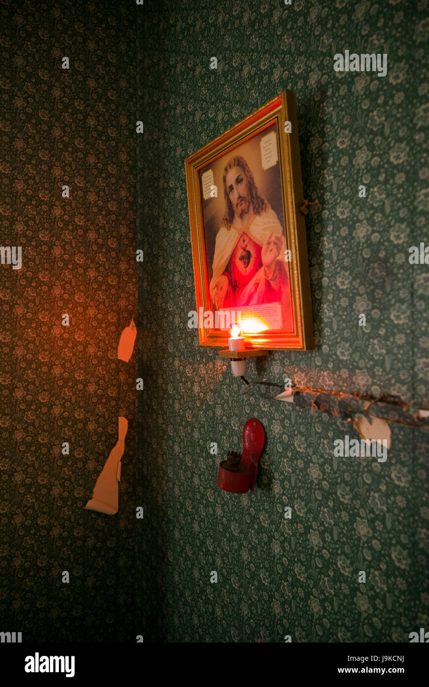 Ireland, County Limerick, Limerick City, Frank McCourt Museum, replica of McCourt family home, religious painting of Jesus and Sacred Heart Stock Photo