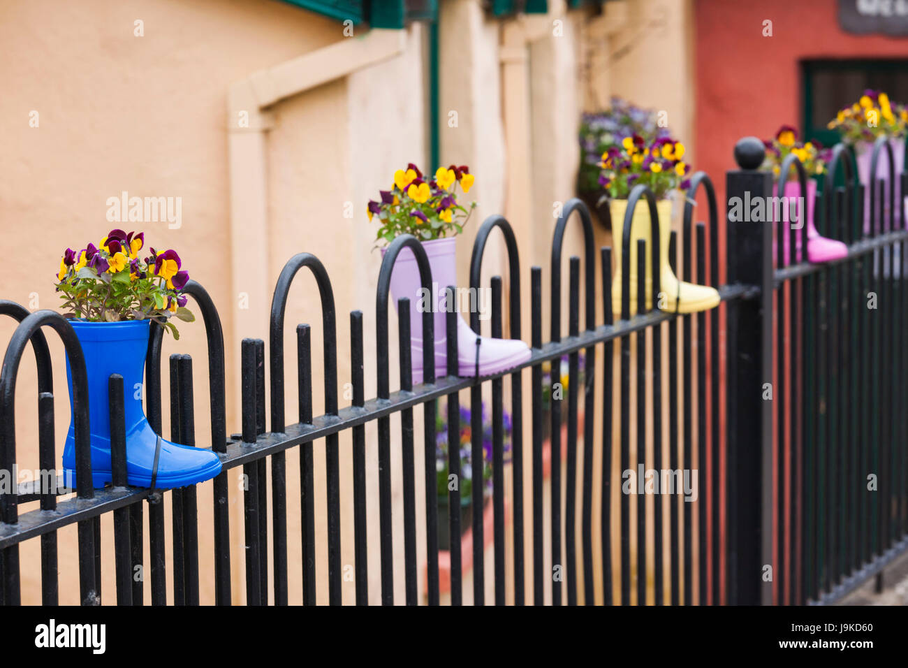 Ireland, County Kerry, Dingle Peninsula, Cloghane, fence decorated with children's boots Stock Photo