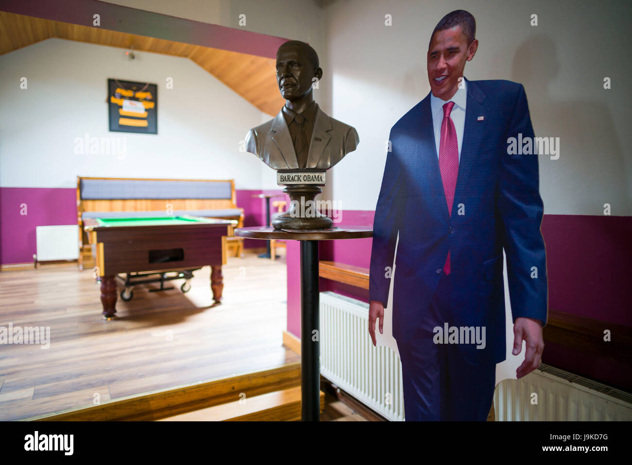 Ireland, County Offaly, Moneygall, Hayes' Bar and Pub, site of US President Barack Obama's visit, interior with bust and life size portrait of President Obama Stock Photo