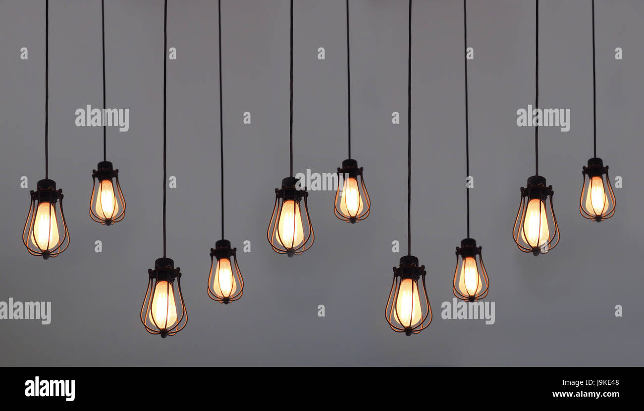 Beautiful hanging light bulbs on plain background for card, banner,  wallpaper Stock Photo - Alamy