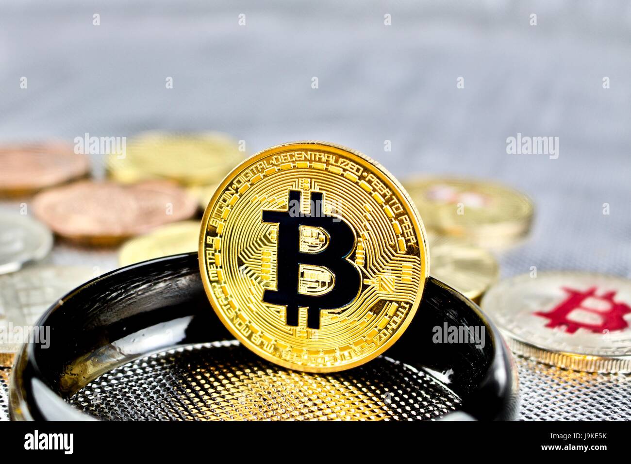 Cryptocurrency physical gold bitcoin coin on black ring Stock Photo - Alamy