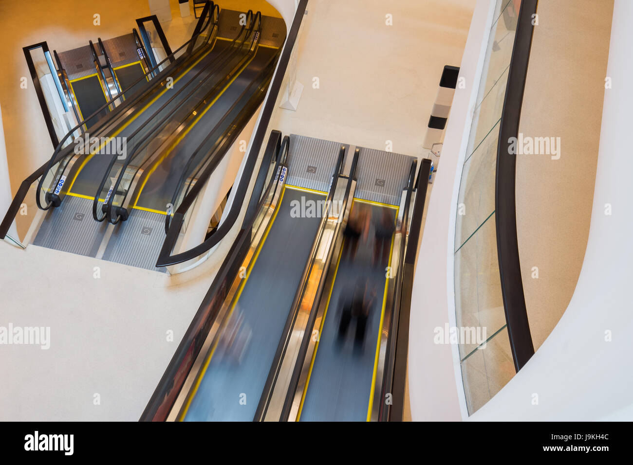 escalator layer with person movemont in blur from high Angle view Stock Photo