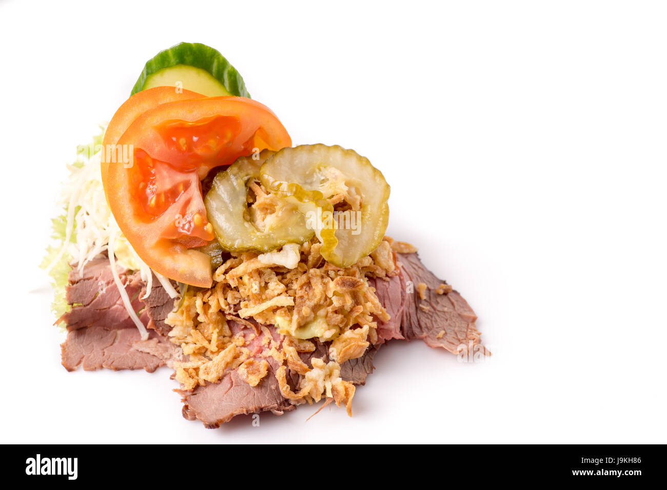 Danish specialties and national dishes, high-quality open sandwich,Roast beef with remoulade and roasted crisp onions, isolated on white background Stock Photo