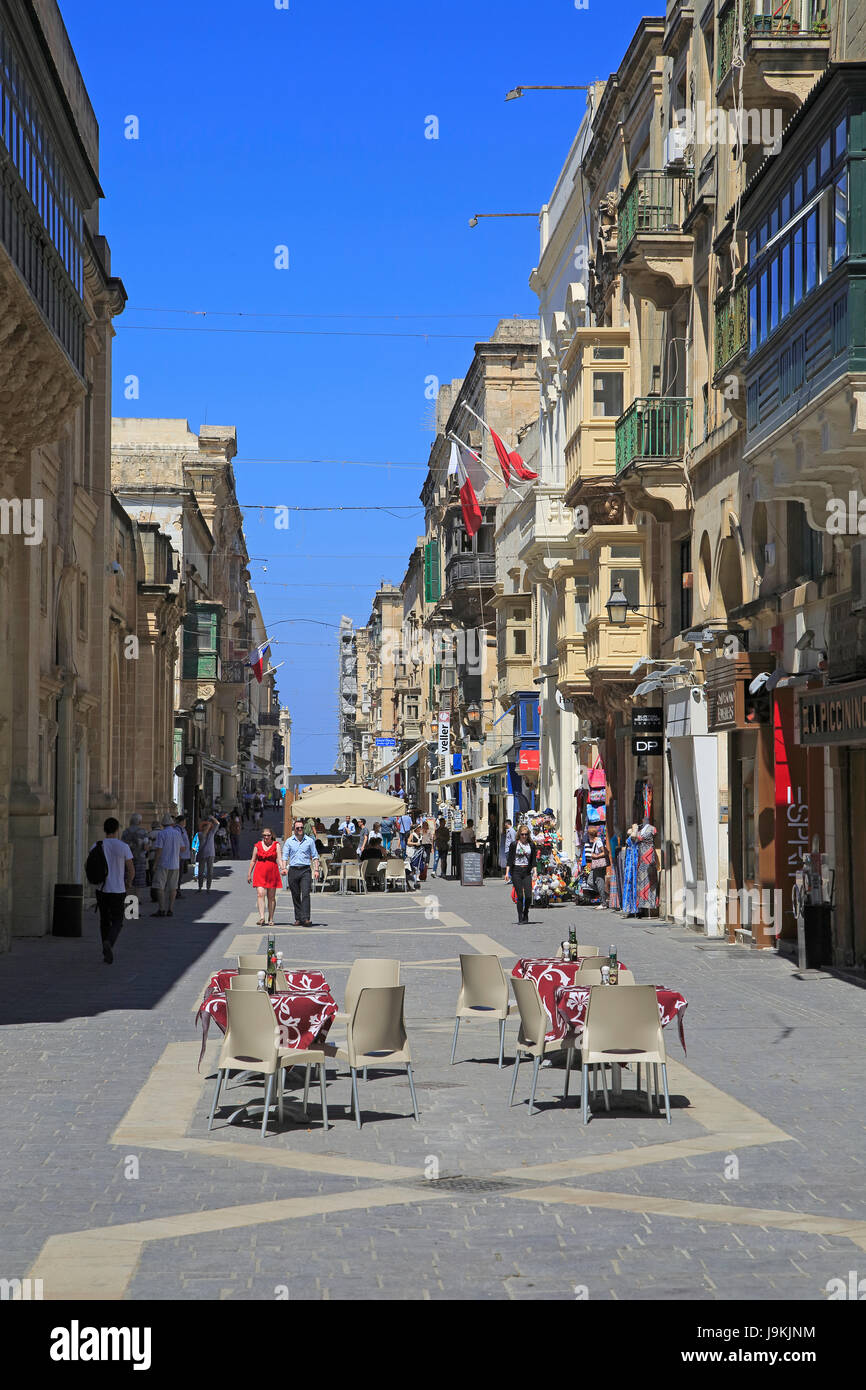 Busy city centre pedestrianised street in  Valletta, Malta Stock Photo