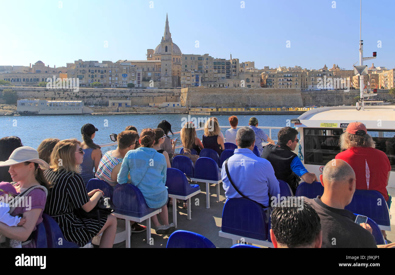 People onboard ferry boat crossing harbour from Sliema to Valletta, Malta Stock Photo