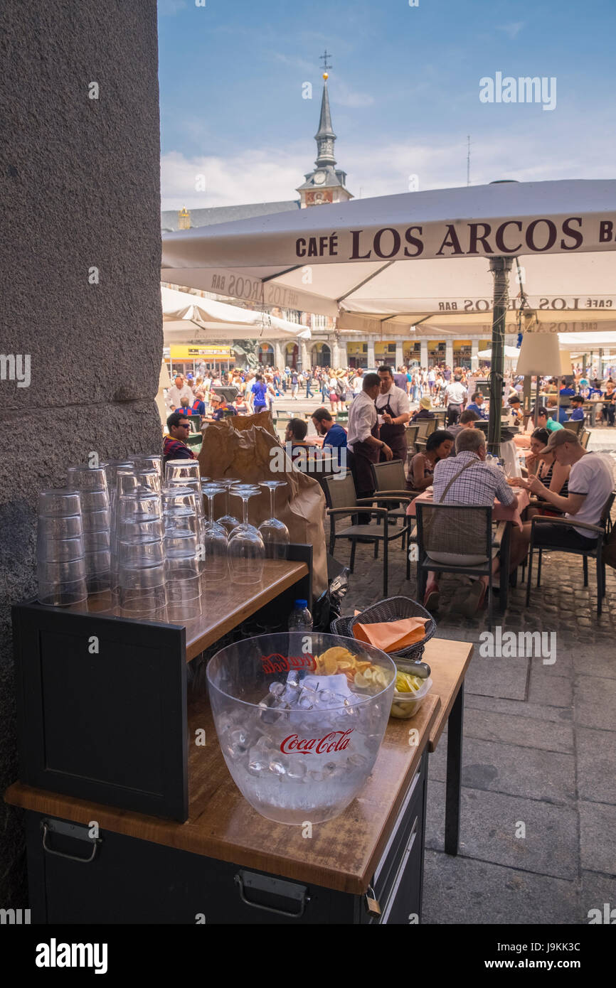 Tourists eating and drinking at a cafe in Plaza Major, Madrid, Spain Stock Photo