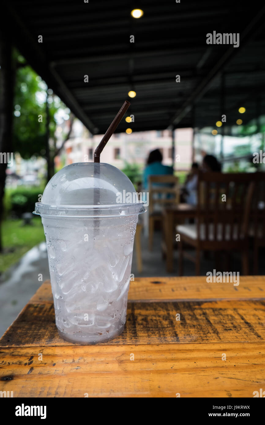 A glass of ice cubes on wooden Stock Photo - Alamy