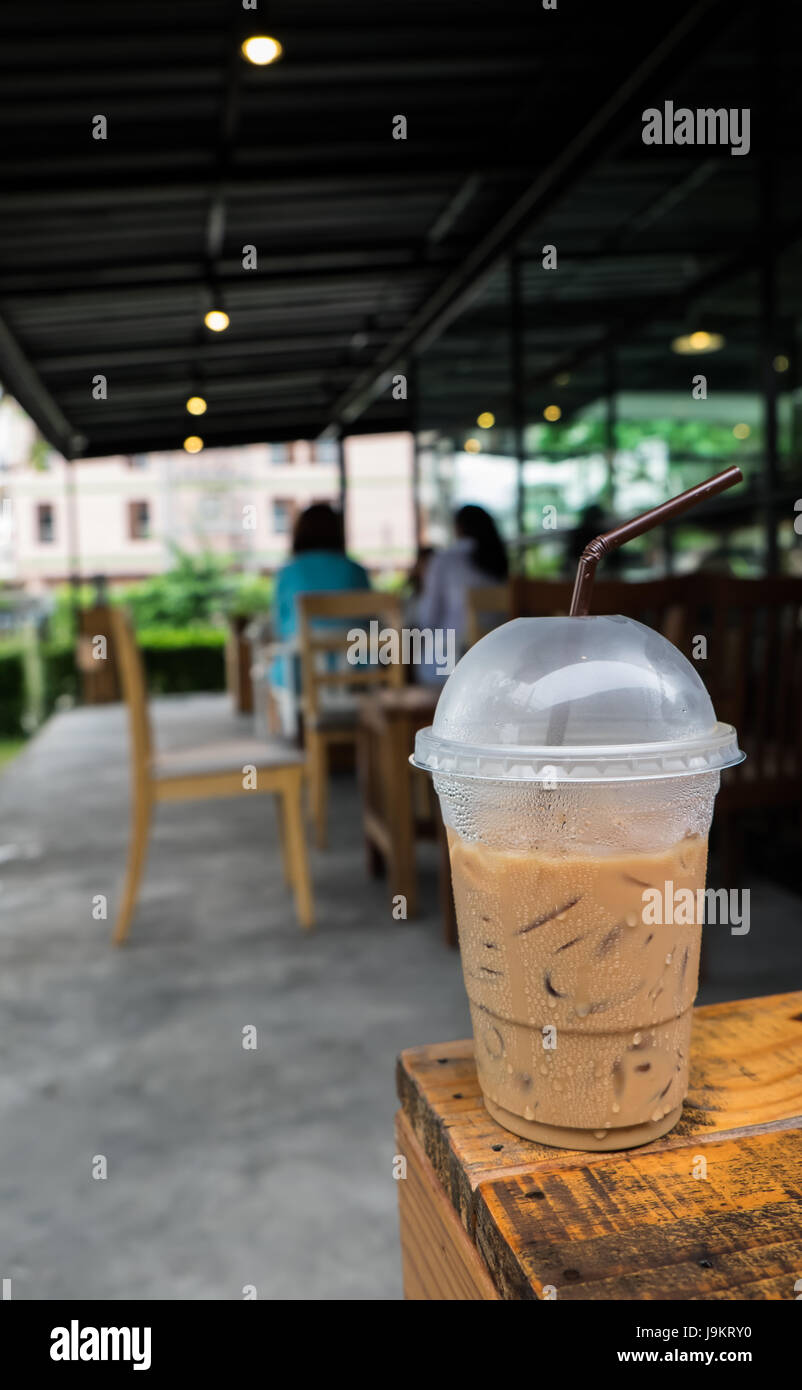 Hand Holding Iced Latte with Straw in Plastic Cup at Garden Blur Cafe  Restaurant in Hot Sunny Day.coffee Shop,cafe Leisure Stock Photo - Image of  delicious, restaurant: 156313504
