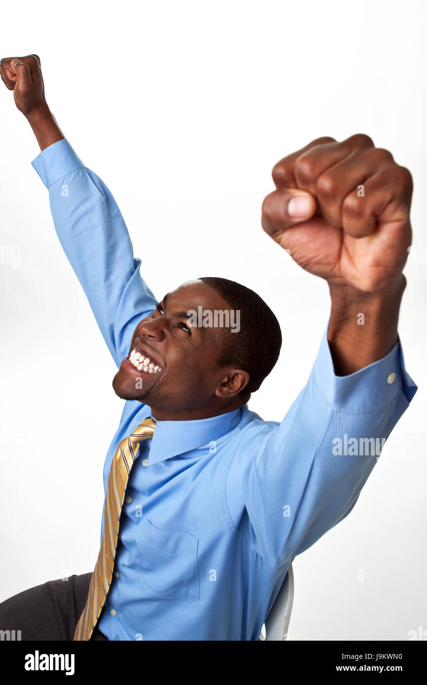 Excited African man shouting with his hands in the air. Stock Photo