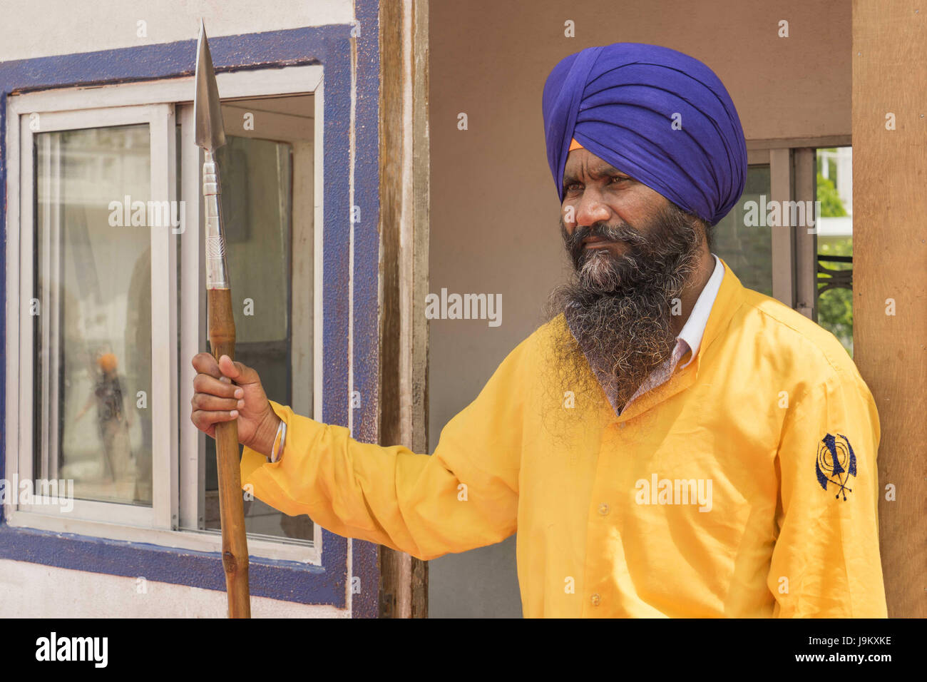 volunteer security guard at golden temple, amritsar, punjab, India