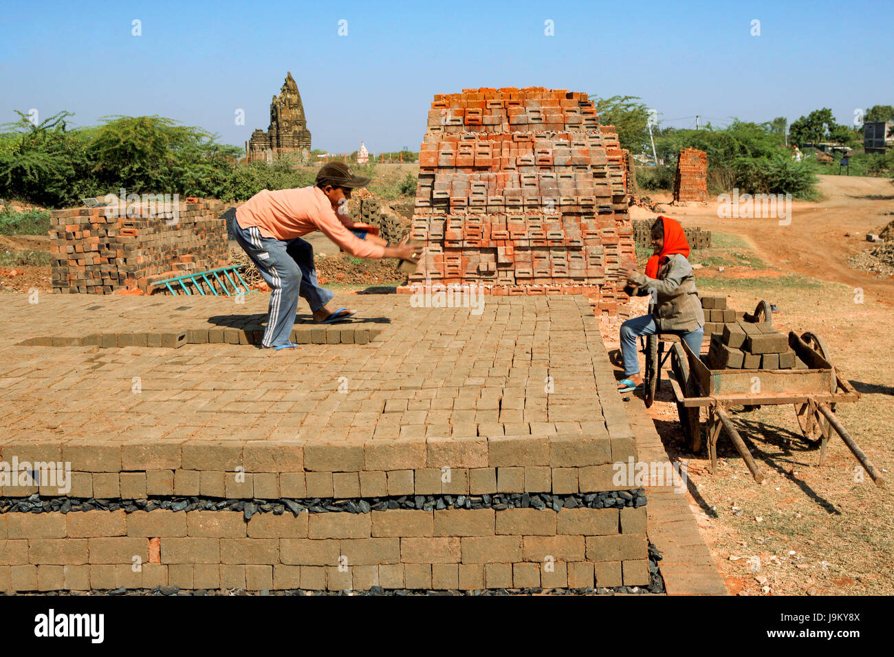 boy working in bricks factory, Barwani, Madhya Pradesh, India, Asia Stock Photo