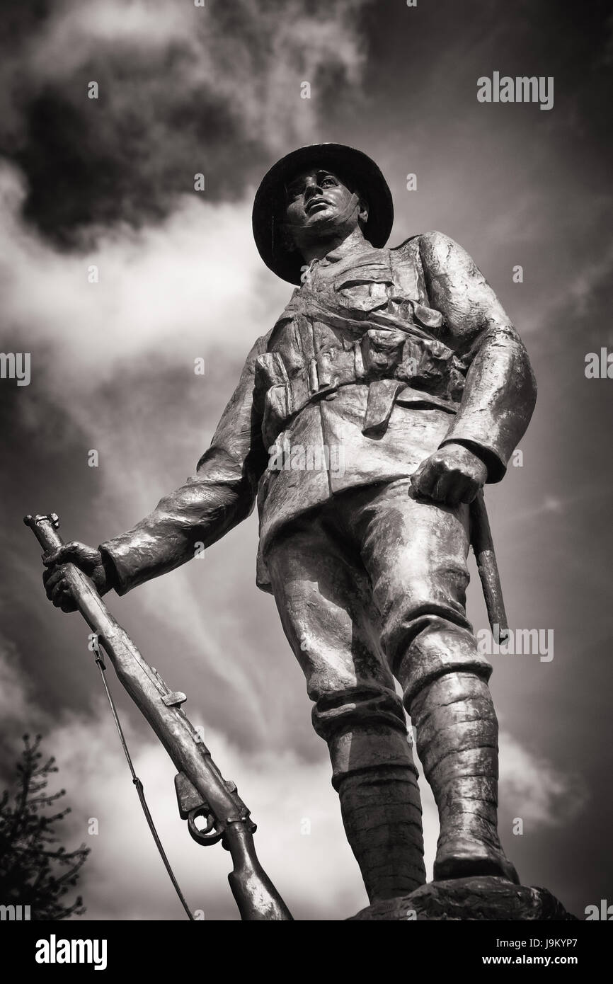 War Memorial statue in bronze of Great War King's Royal Rifle Corps Infantryman at Winchester cathedral, Winchester, Hampshire, UK Stock Photo