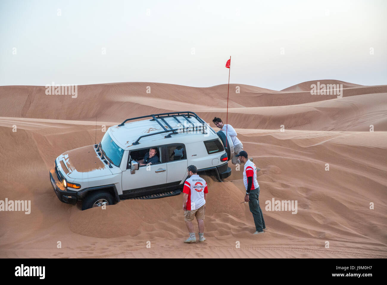 Car stuck on sand whilst off-roading in Dubai, United Arab Emirates Stock Photo