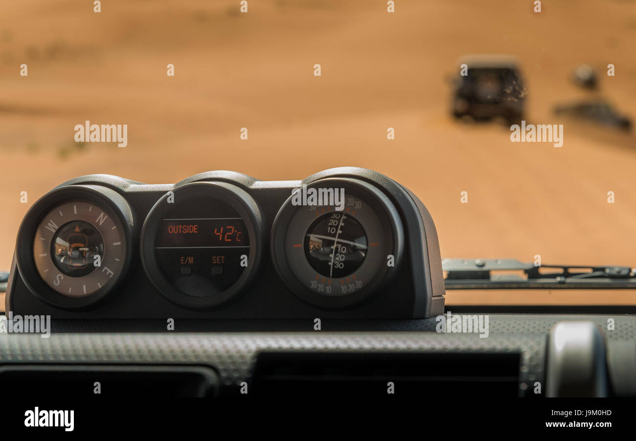 Temperature gauge at a dashboard while off roading with 4x4 near Dubai