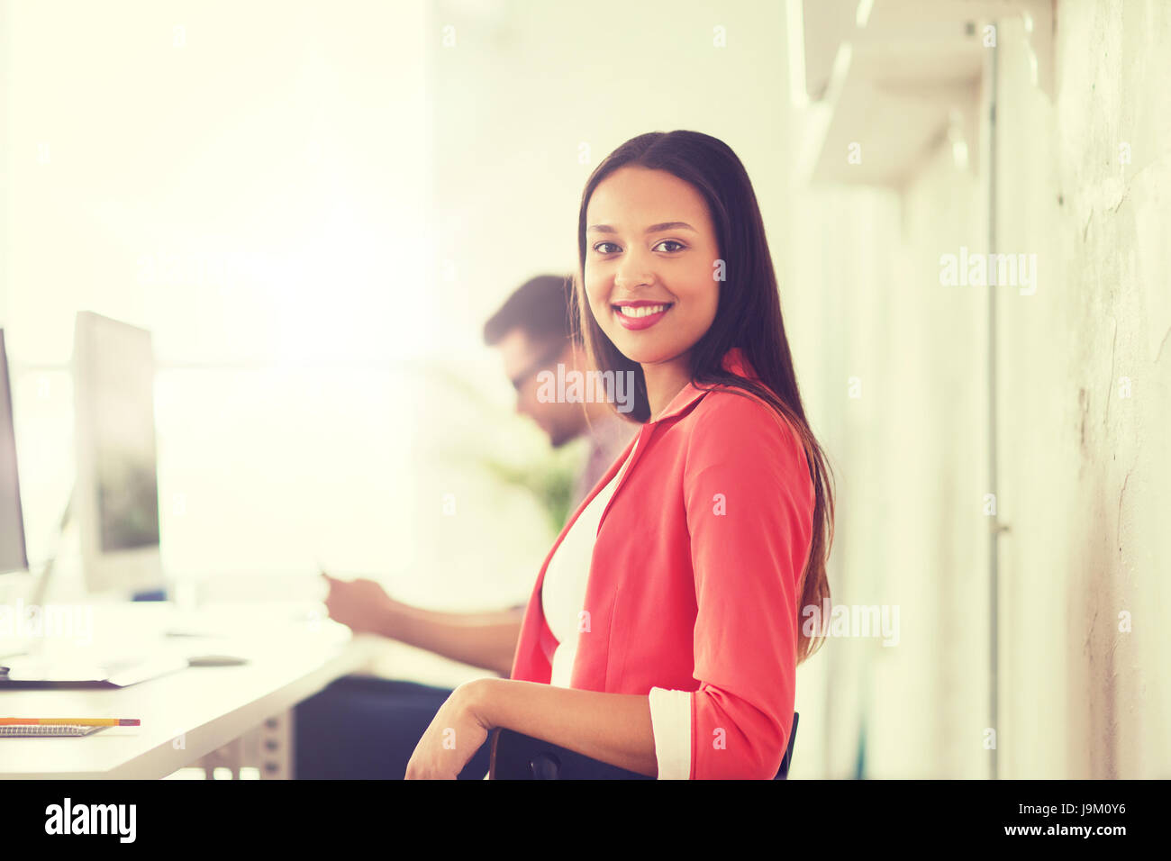 happy african woman with computer at office Stock Photo - Alamy