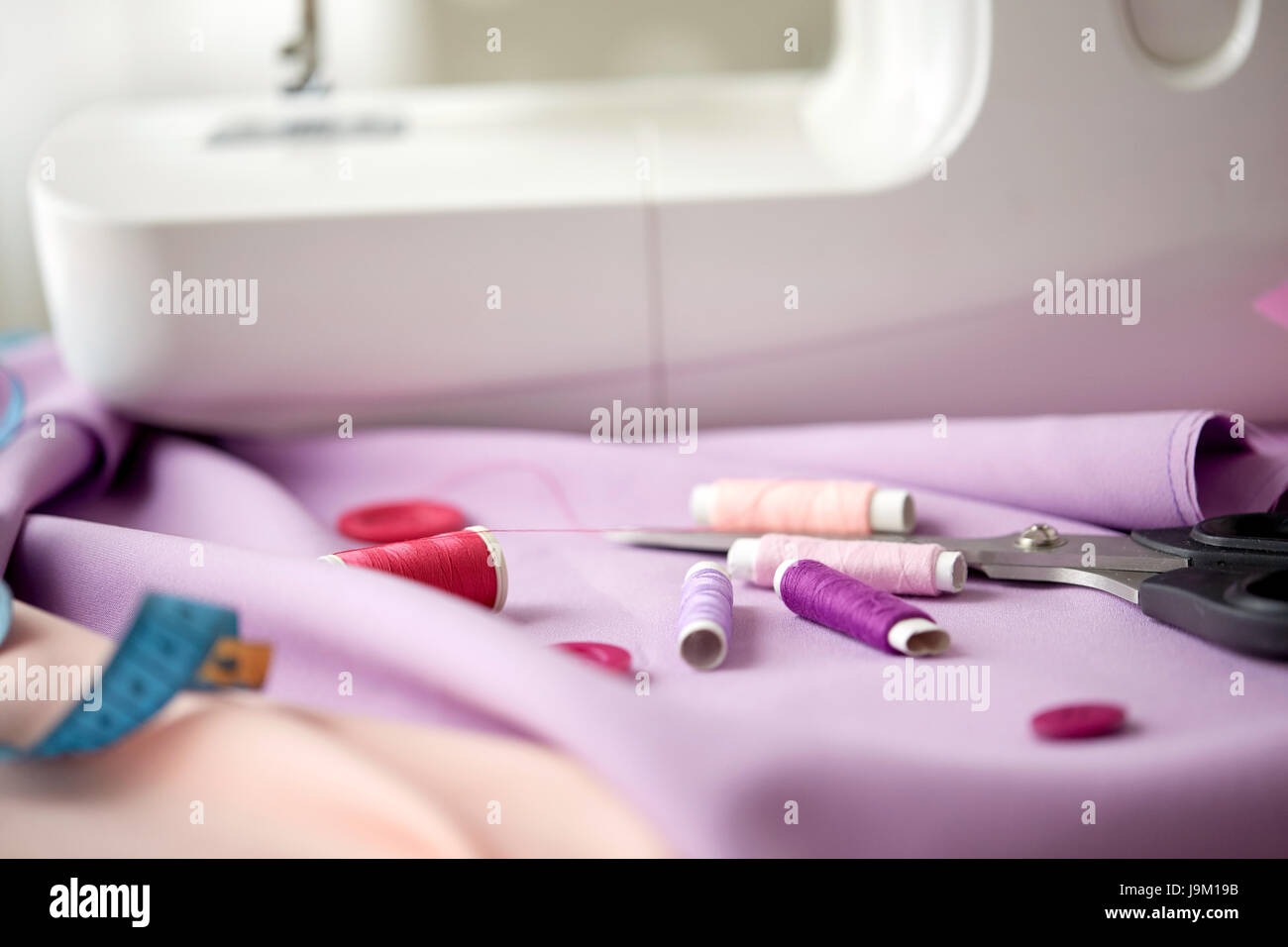 sewing machine, scissors, buttons and fabric Stock Photo Alamy