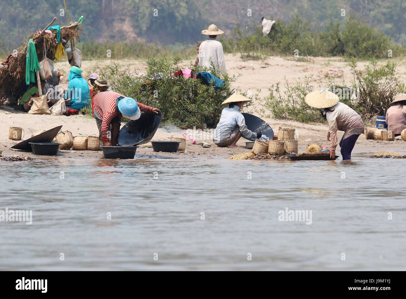 Panning for gold on the Mekong in Laos near Luang Prabang Stock Photo