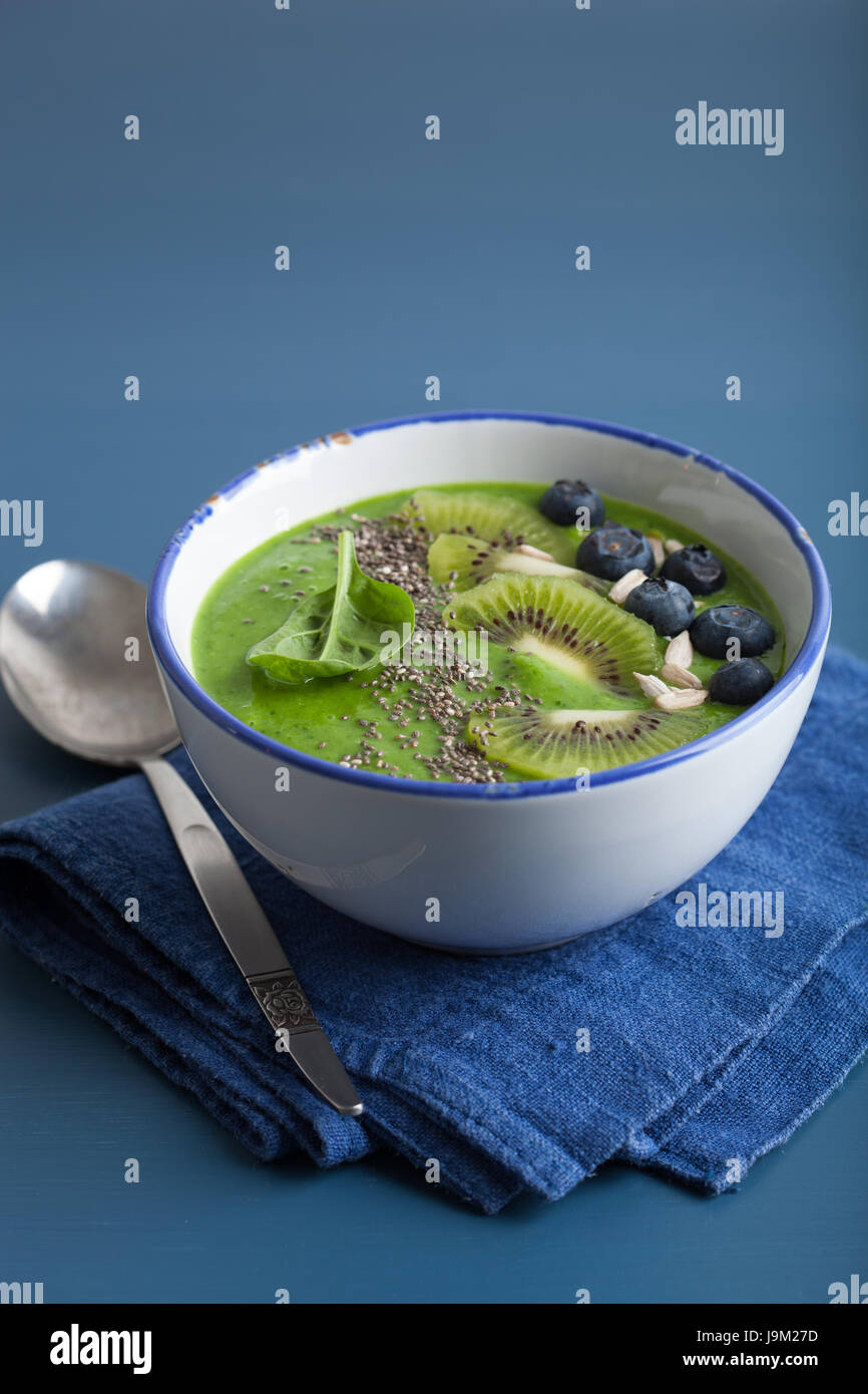 green smoothie bowl spinach kiwi blueberry banana with chia seed Stock