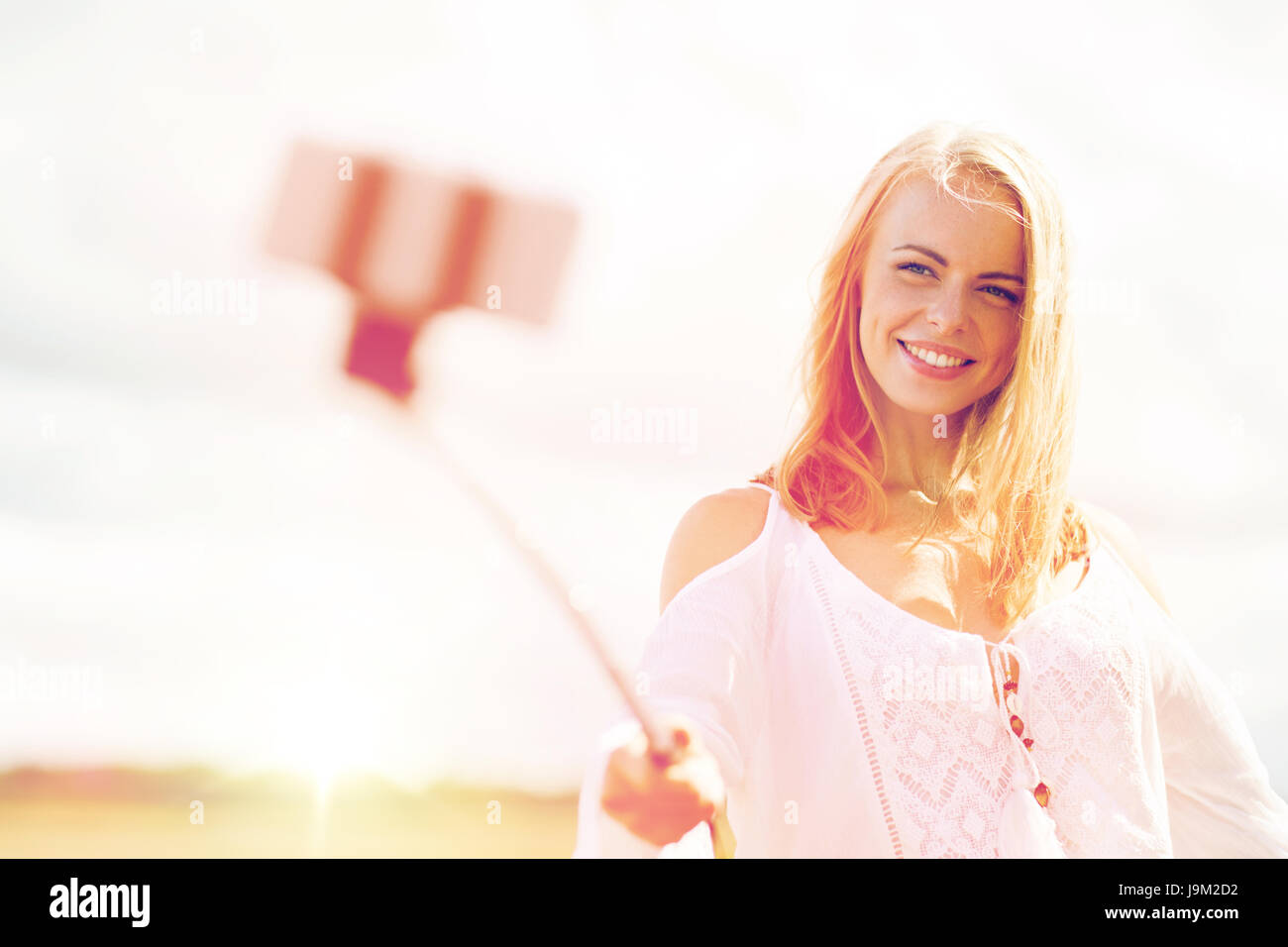 happy young woman taking selfie by smartphone Stock Photo - Alamy