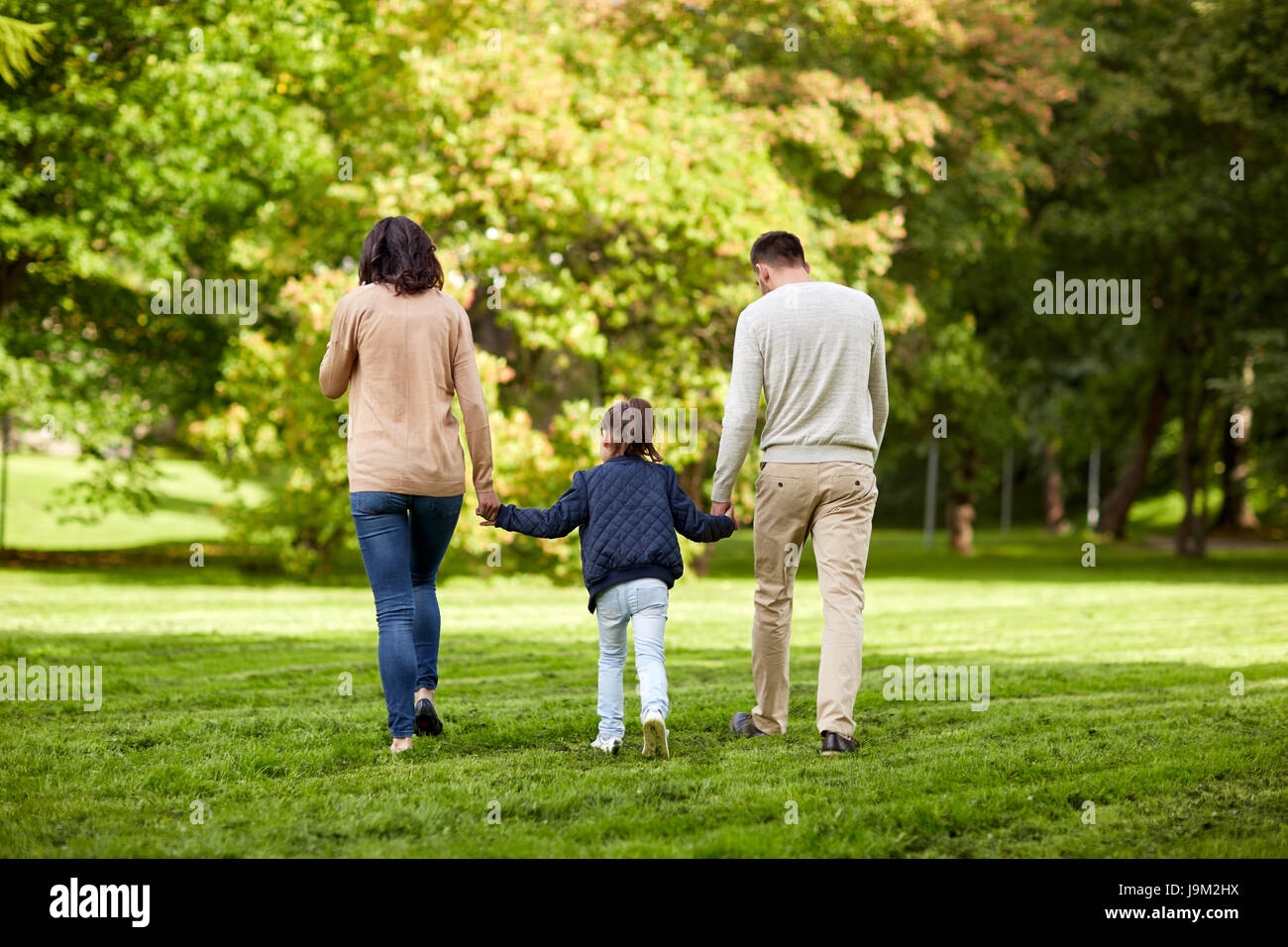 happy family walking in summer park Stock Photo - Alamy