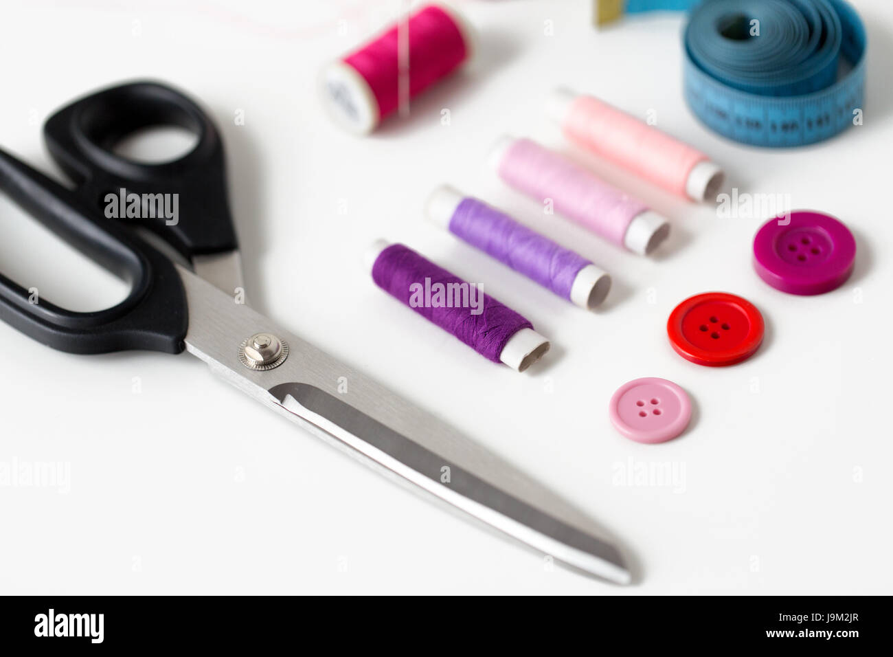 scissors, sewing buttons, threads and tape measure Stock Photo Alamy