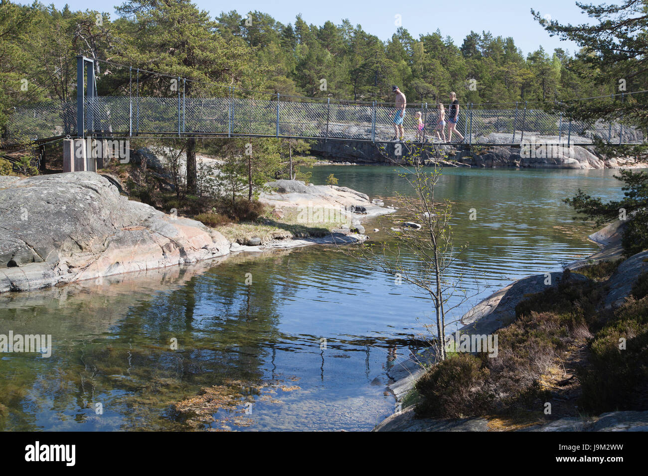 STENDÖRREN Naturereserve a smaller suspension bridge over a bay outside Nyköping Södermanland 2017 Stock Photo