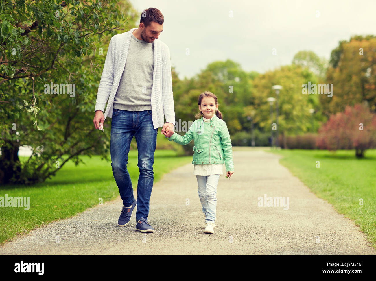 happy family walking in summer park Stock Photo - Alamy