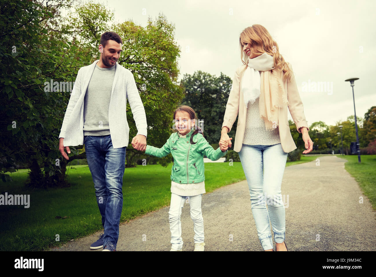 happy family walking in summer park Stock Photo - Alamy