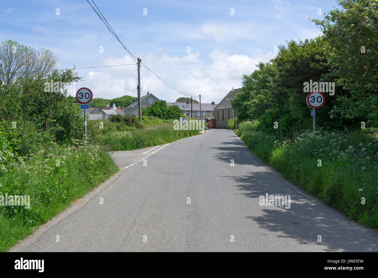Narrow country road into the small village of Barripper, Cornwall England UK. Stock Photo