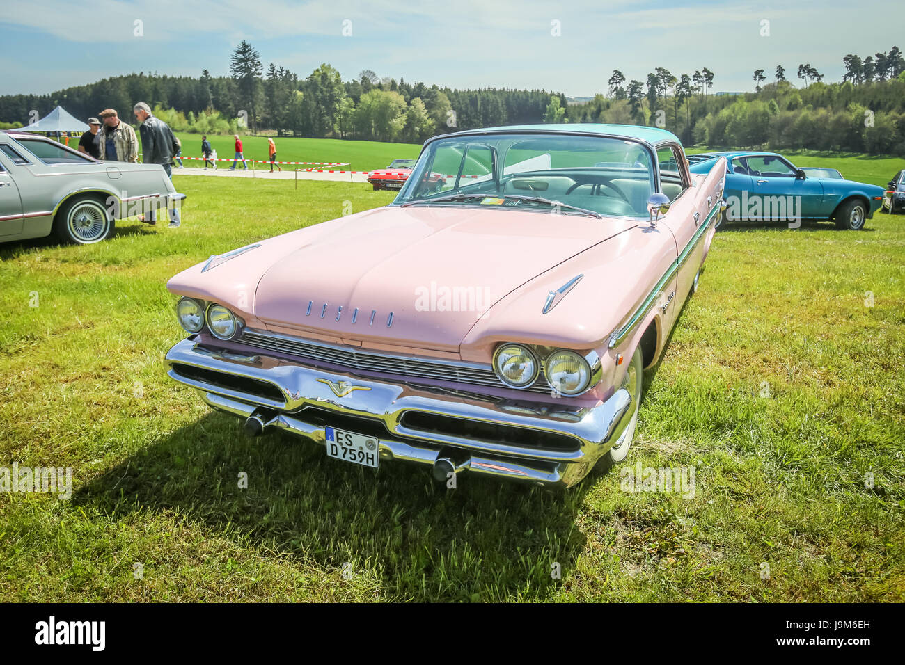 NANDLSTADT, GERMANY - MAY 6, 2017 : People sightseeing american automobile DeSoto Chrysler displayed at the US Car meeting in Nandlstadt, Germany. Stock Photo