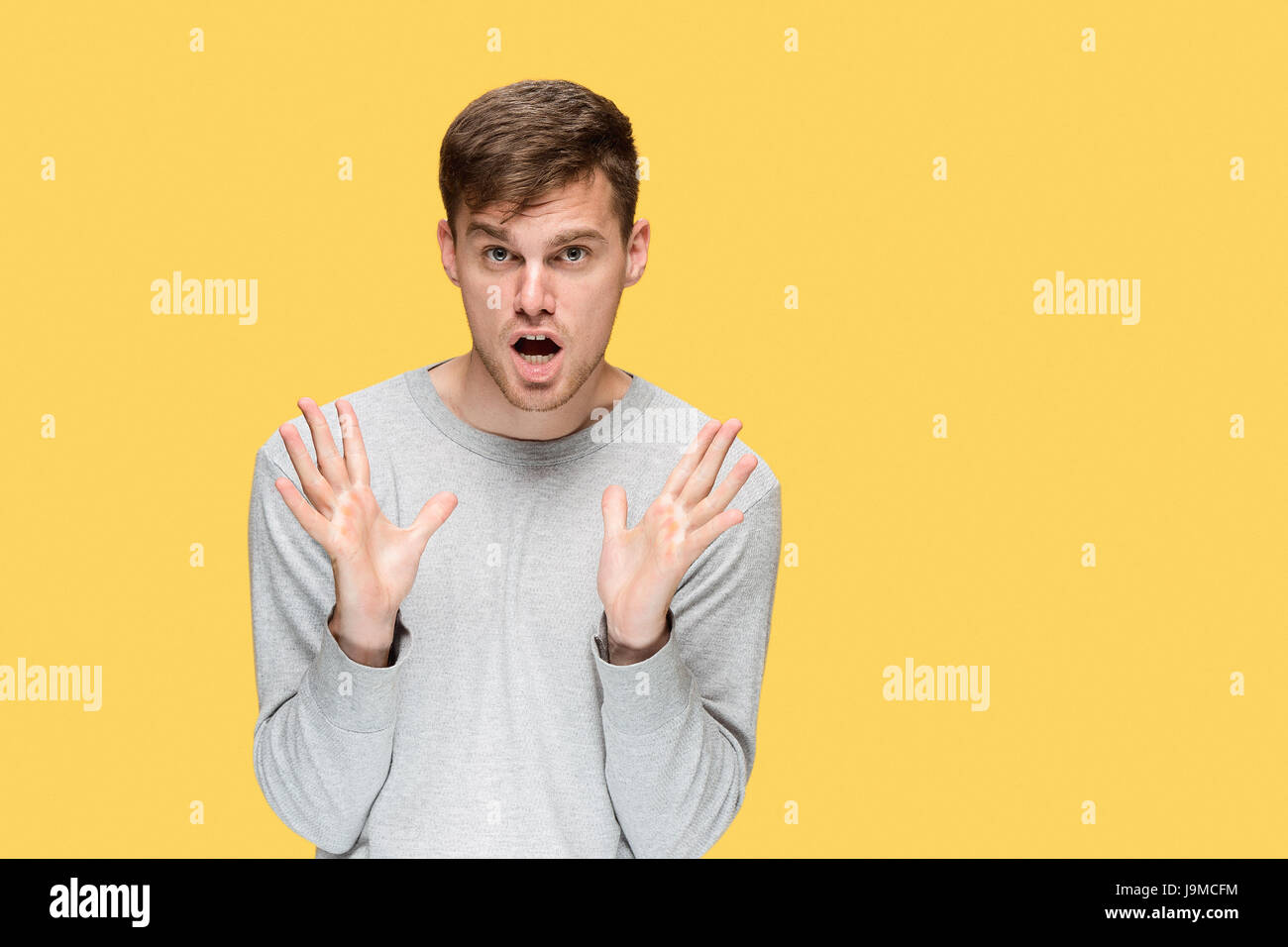 The young man smiling and looking at camera Stock Photo - Alamy
