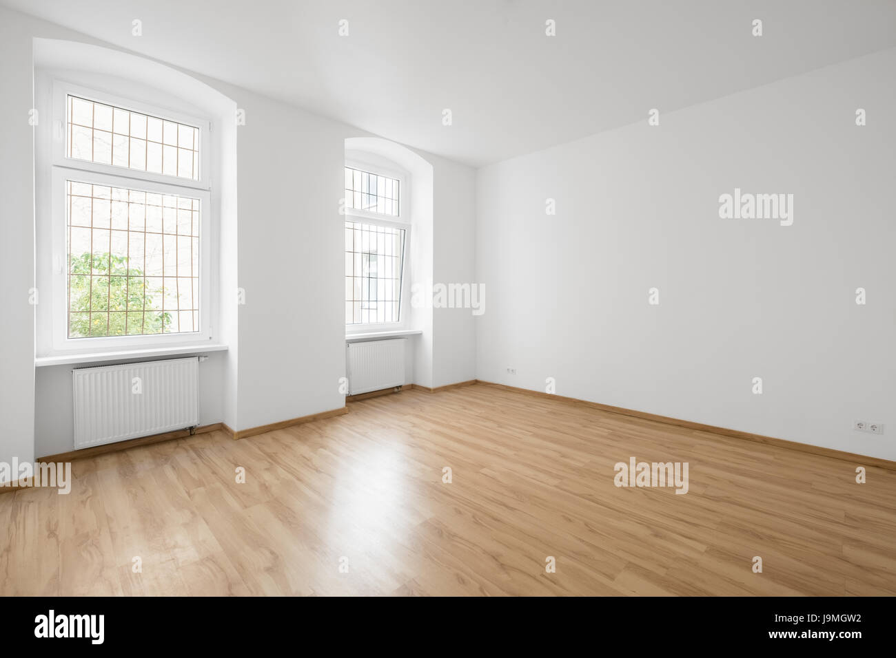 empty room, wooden floor in new apartment Stock Photo