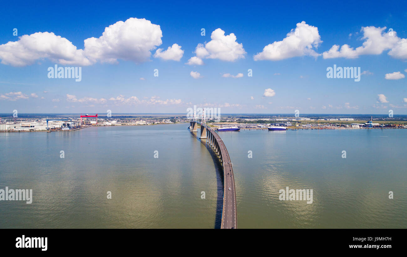 The Saint Nazaire bridge and the Atlantic shipyards in Loire estuary, France Stock Photo