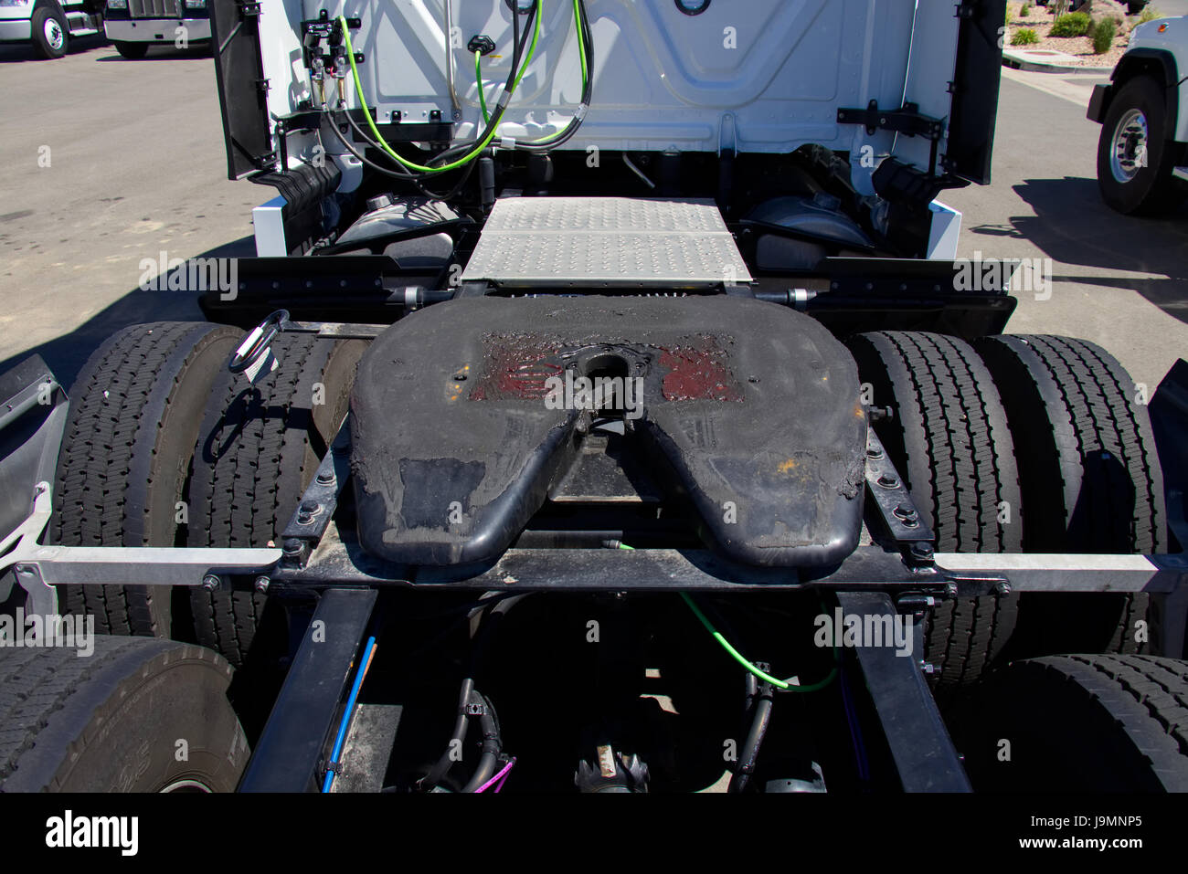 Row of Semi Trucks showing 5th Wheel Assemblies. All Trademarks