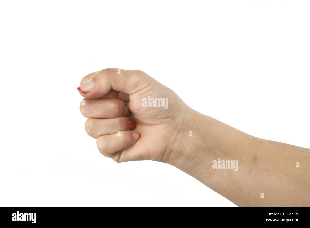 The woman hand macking clenched her fist. Isolated on white background, clipping path Stock