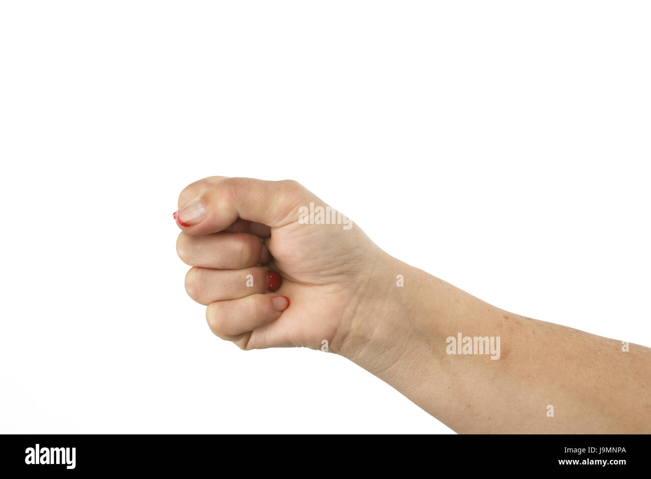 The woman hand macking clenched her fist. Isolated on white background, clipping path Stock