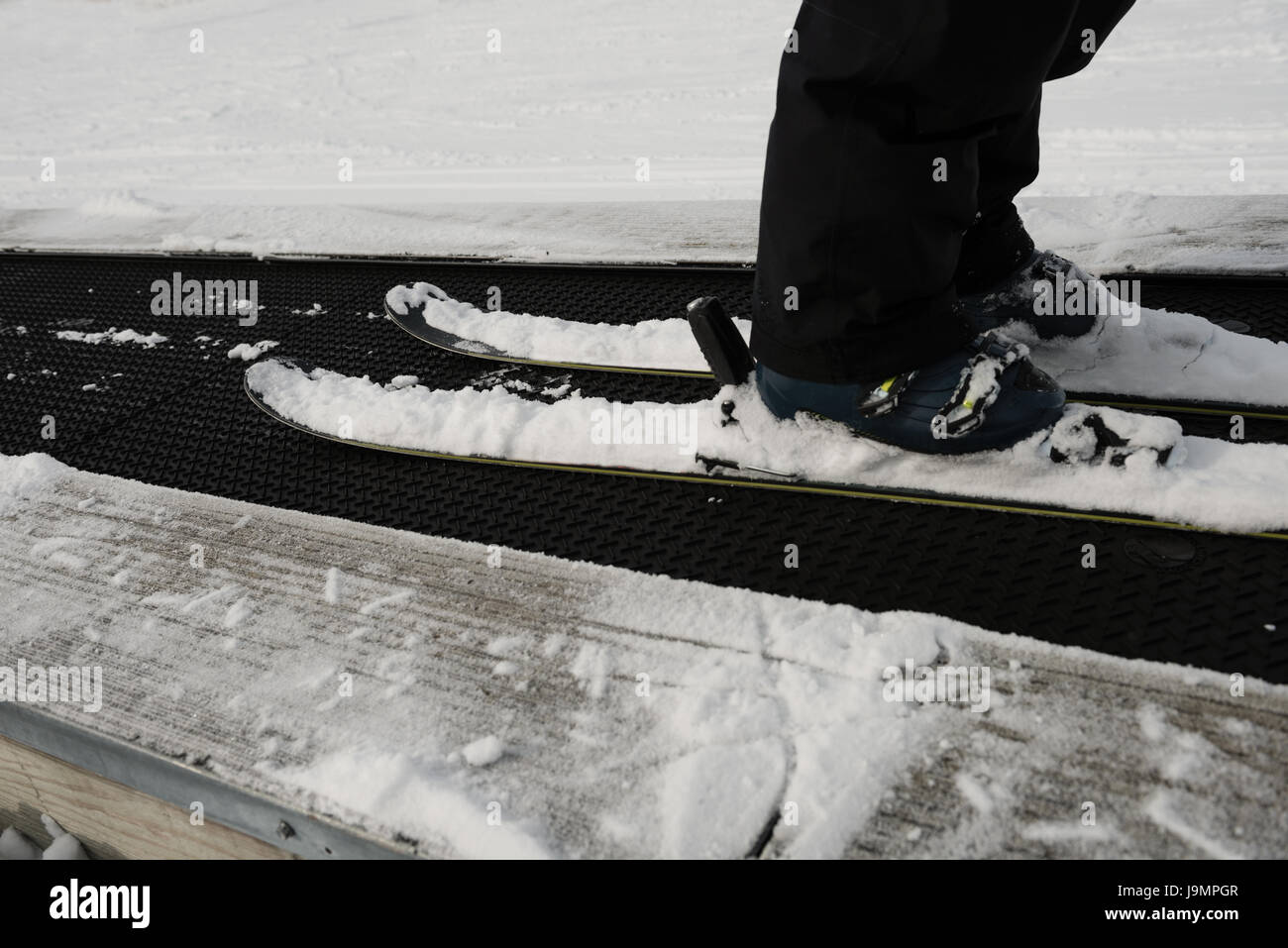 Low-section of skier skiing on a track in ski resort Stock Photo