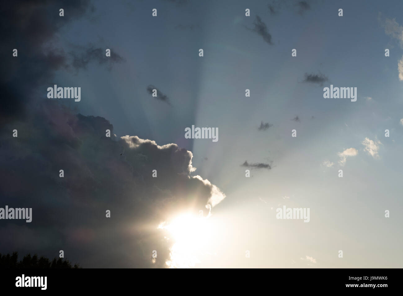 Sunrays Illuminating Strom Clouds Stock Photo