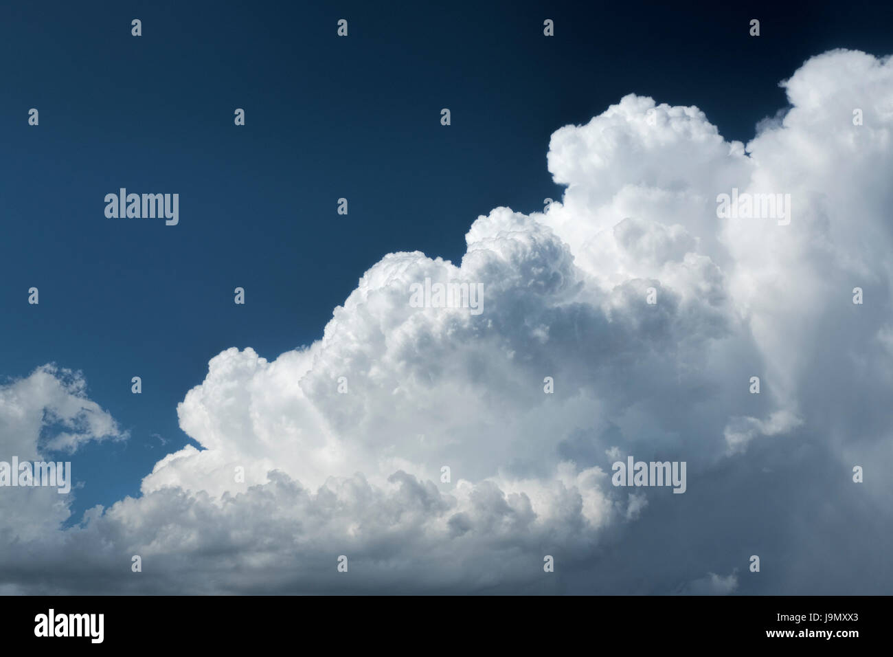 Towering Cumulus Clouds Against Beautiful Blue Sky Stock Photo