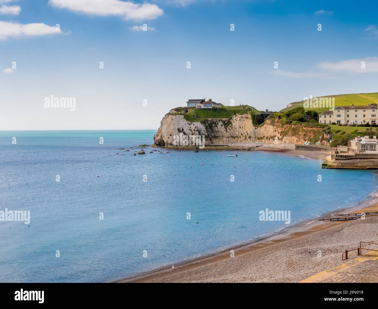 House on cliff on coast Bay Isle Of Wight England Stock Photo